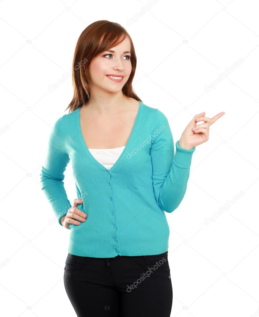Closeup portrait of pretty happy young woman pointing at copyspace isolated on white background
