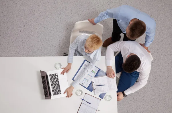 Business people sitting and discussing at business meeting, in office — Stock Photo, Image