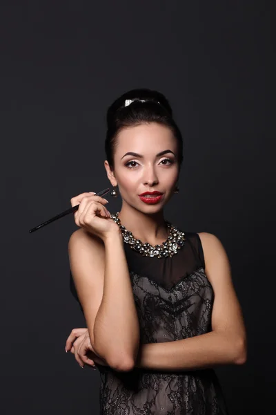Portrait of young beautiful woman with jewelry — Stock Photo, Image