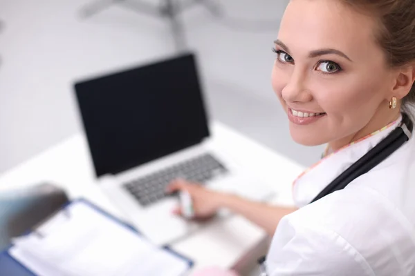 Closeup portrait of a happy young doctor sitting — Stock Photo, Image