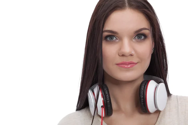 Smiling girl with headphones isolated on white background — Stock Photo, Image