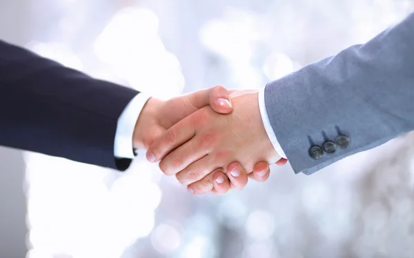 Handshake - ruka drží na bílém pozadí — Stock fotografie