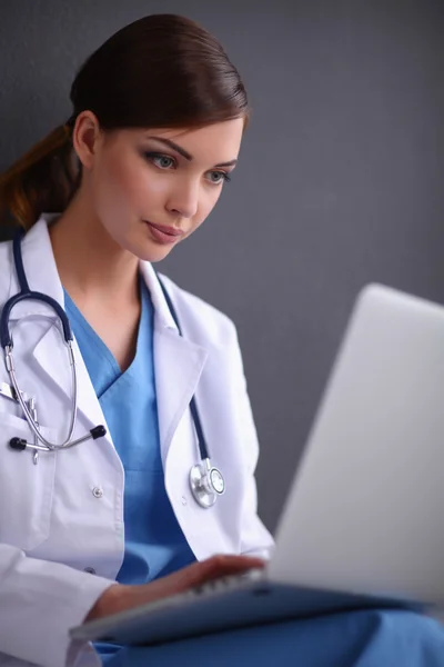 Female doctor working isolated on grey  background — Stock Photo, Image