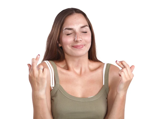 Retrato de mujer cruzando dedos sobre fondo blanco . — Foto de Stock