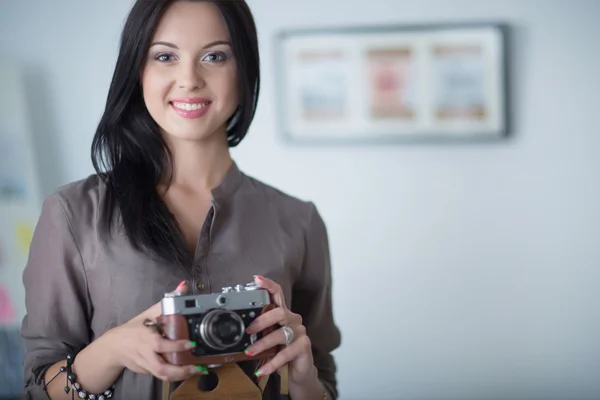 Woman is a proffessional photographer with camera — Stock Photo, Image