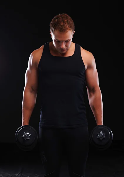 Fit muscular man exercising with dumbbell — Stock Photo, Image