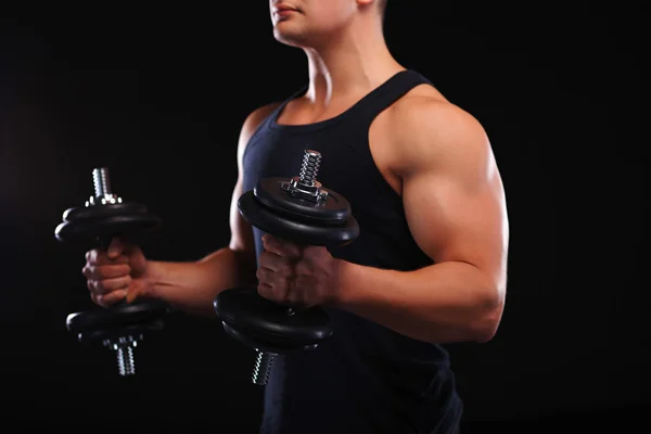 Fit muscular man exercising with dumbbell — Stock Photo, Image