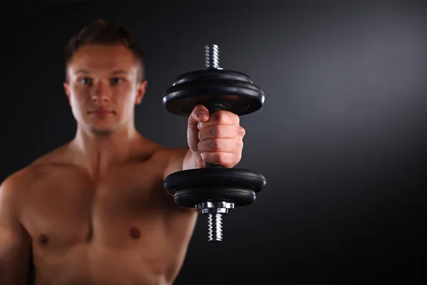 Fit muscular man exercising with dumbbell — Stock Photo, Image