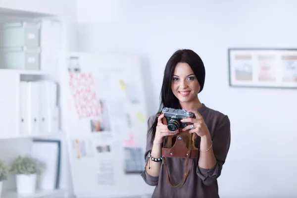 Woman is a proffessional photographer with camera — Stock Photo, Image