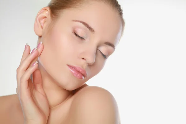 Woman cares for the skin neck- posing at studio isolated on whi Stock Photo