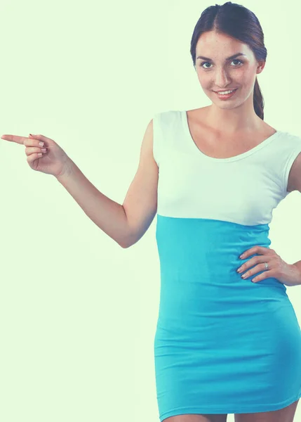 Portrait of a smiling young woman pointing up — Stock Photo, Image