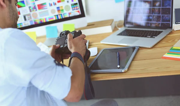 Portrait of young designer sitting at graphic studio in front of laptop and computer while working online — Stock Photo, Image