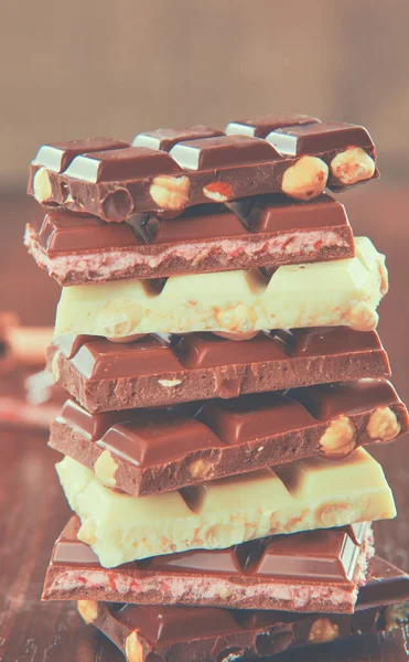 Mix of chocolate pieces on table, close-up — Stock Photo, Image