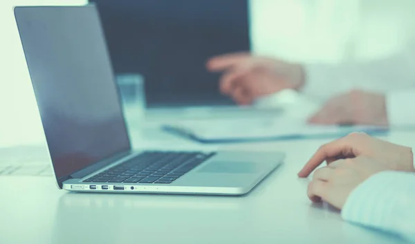 Young businessman working in office, sitting at desk — Stock Photo, Image