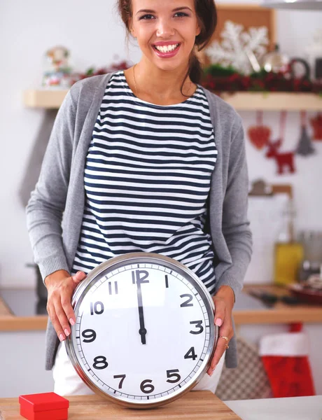 Portrait Smiling Young Woman Holding Clock Christmas Decorated Kitchen — Stock Photo, Image