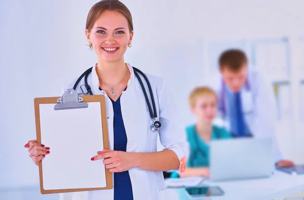 Attractive Female Doctor Folder Front Medical Group — Stock Photo, Image