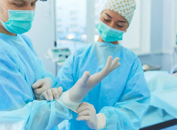 Male surgeon on background in operation room.