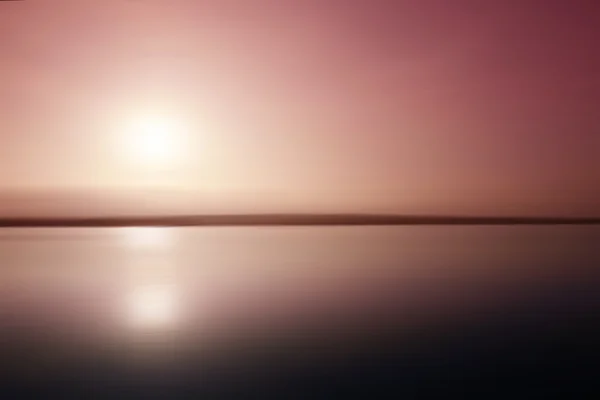 Pink sunset reflected in a lake — Stock Photo, Image
