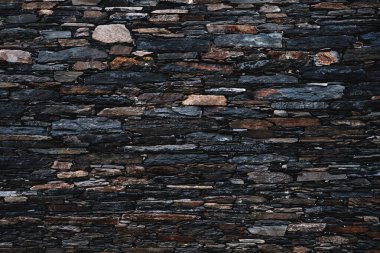 Old rough slate stone wall, traditional construction in the Courel mountains in Galicia, Spain clipart