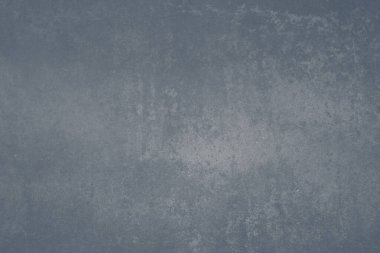 Pale blue colored ceramic wall tile with worn out effect texture, grunge background 