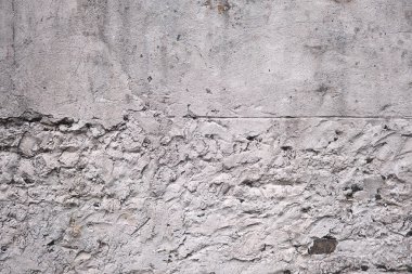 Old traditional white limewash plastered stonework wall