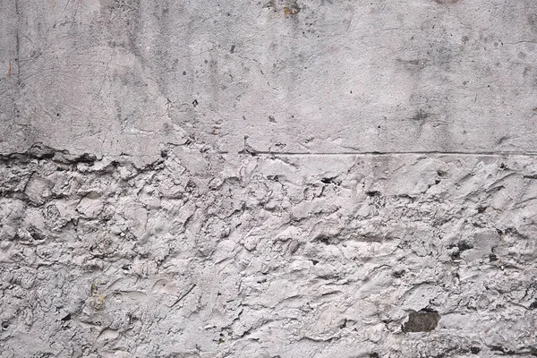 Old traditional white limewash plastered stonework wall