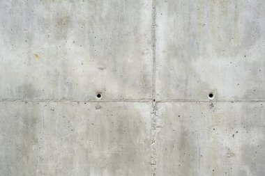Old weathered raw concrete formwork wall, grunge background