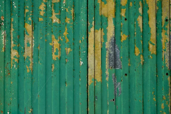 Old Metal Shutter Scraps Green Yellow Paint Grunge Background — Zdjęcie stockowe