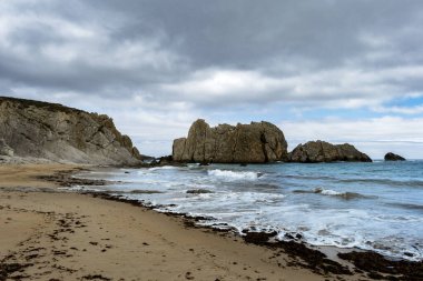 Sea stacks in the Arnia beach, Costa Quebrada, Broken Coast, Cantabrian sea, Cantabria, Spain