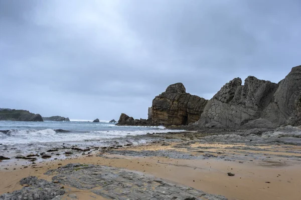 Rocky beach in the cantabrian coast, Playa de Portio, Liencres, Costa Quebrada, Pielagos, Cantabria, Spain