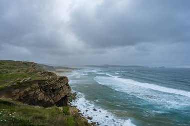 Wild coastline by the cantabrian sea in Dunas de Liencres natural park, Pielagos, Spain