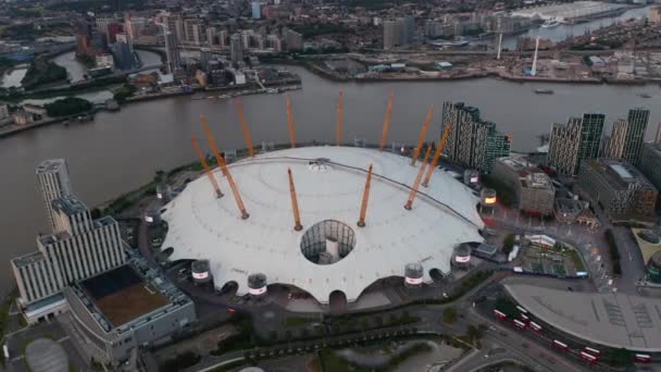 Slide and pan aerial footage of Millennium Dome. Futuristic entertaining facility on south bank of River Thames. London, UK — Stock Video