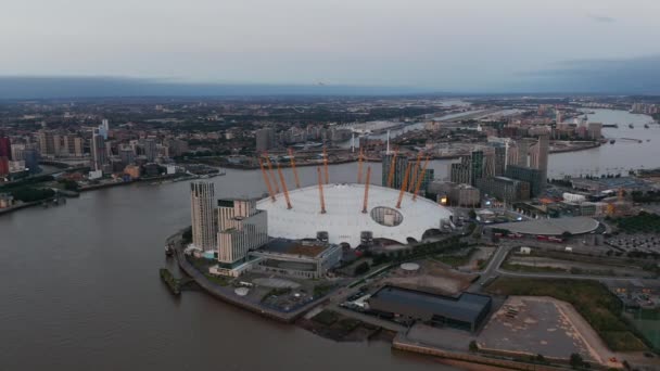 Aerial view of futuristic Millennium Dome. River Thames calmly flowing around The O2 entertaining district. London, UK — Stock Video