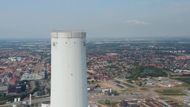 Aerial view flight over the chimney of the Esbjerg Power Station In Esbjerg. Drone view mowing toward revealing the stunning skyline of one of the most important seaport in Scandinavia — Stock Video