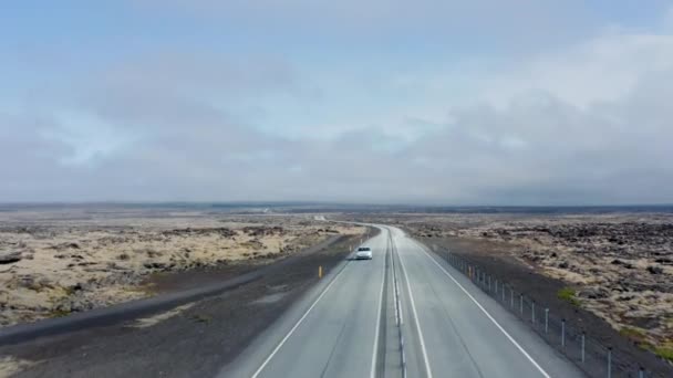 Aerial view gently rising over Ring Road, the most important highway in Iceland. Drone view showing stunning and surreal skyline of the island — Stock Video