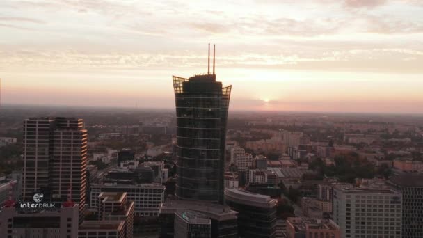 Forwards fly towards modern futuristic high rise building tower high above urban development. Warsaw, Poland — Stock Video