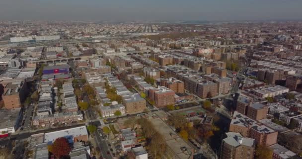 Fly above large housing estate. Aerial panoramic shot of apartment buildings in residential borough. Queens, New York City, USA — Stockvideo