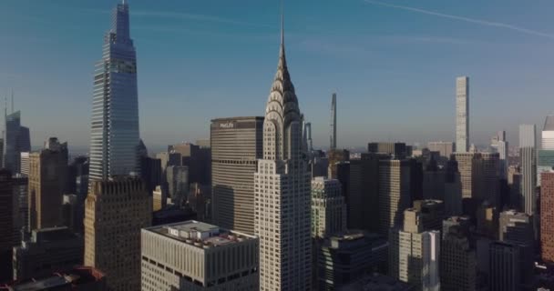 Fly about beautiful top of Chrysler building. Aerial view of surrounding high rise office towers. Manhattan, New York City, USA — стокове відео