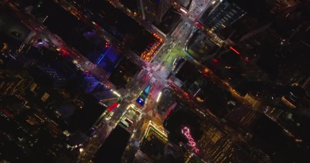 Aerial birds eye overhead top down view of Times Square. Rocket shot of colourfully illuminated visual tourist attraction. Manhattan, New York City, USA — стокове відео