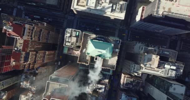 Aerial birds eye overhead top down ascending shot of smoking chimney on roof of historic buildings in town development. Manhattan, New York City, USA — Stockvideo