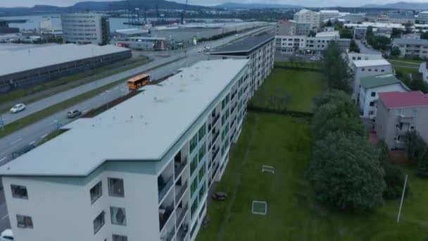 Drone view of motorway in Reykjavik suburbs, Iceland capital city. Aerial view revealing sundahofn cargo port in background, the largest icelandic harbor — стокове відео