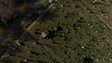 Aerial birds eye overhead top down view of rows of gravestones on historic Calvary Cemetery. Queens, New York City, USA