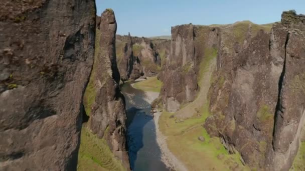 Rock ravine with creek on bottom. Forwards fly between steep rock walls. Fjadrargljufur canyon, Iceland — Stock Video