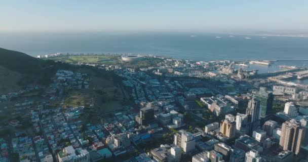 Aerial panoramic footage of various buildings in urban neighbourhood on seaside. Revealing high rise buildings in city centre. Cape Town, South Africa — Stock Video