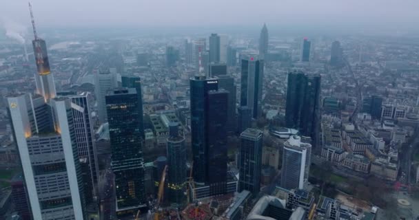 Aerial footage of business centre with high rise modern office towers. Hazy day in large city. Frankfurt am Main, Germany — Stock Video
