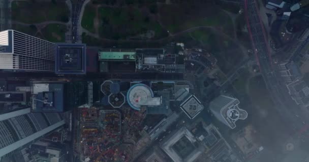 Aerial birds eye overhead top down panning view of downtown skyscrapers in business hub. Shot through sparse clouds. Frankfurt am Main, Germany — Stock Video