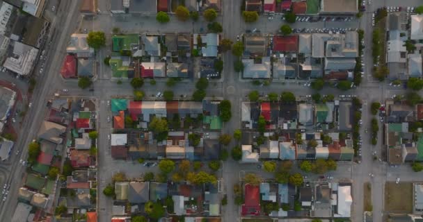 Top down panning footage of urban neighbourhood. Family houses in blocks between streets and athletic sportscenter. Port Elisabeth, South Africa — Stock Video