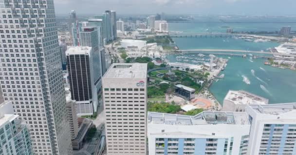 Fly above downtown skyscrapers. Aerial panoramic footage of coast with highway and high rise buildings. Miami, USA — Video