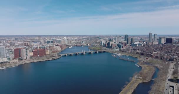 Forwards fly above deep blue surface of Charles river at Longfellow Bridge. Aerial panoramic view of metropolis. Boston, USA — Stock Video