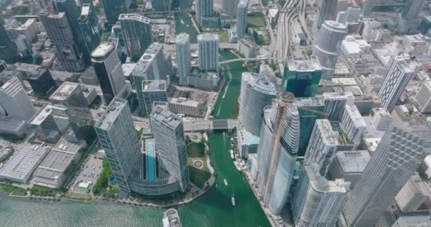 Modern downtown skyscrapers along Miami river. High rise office or apartment buildings. Highway interchange in background. Miami, USA — ストック動画